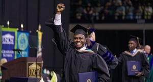 Graduate celebrating at Commencement